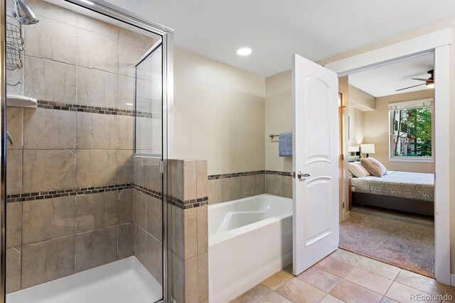 bathroom with shower with separate bathtub, tile patterned floors, and ceiling fan