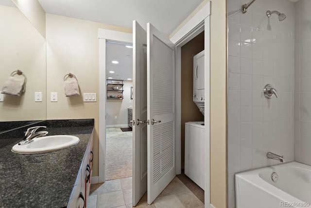 bathroom with vanity, tile patterned floors, and tiled shower / bath