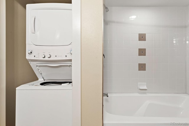 laundry area featuring stacked washer / dryer