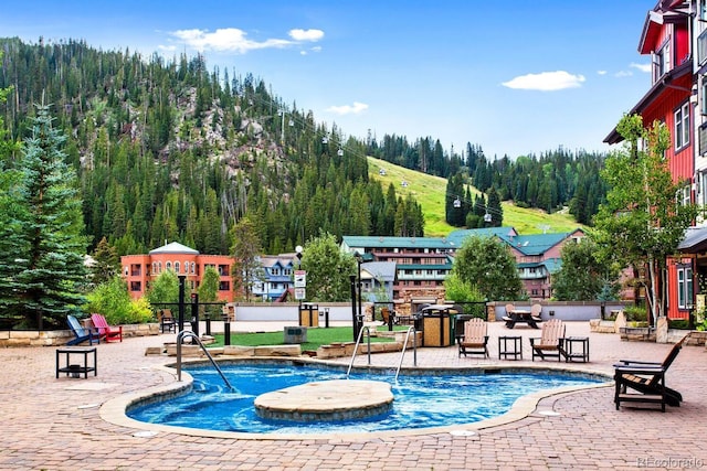 view of pool featuring pool water feature