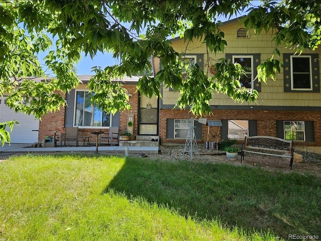 2034 S Truckee St, Aurora, CO 80013 - view of front of house featuring brick siding and a front lawn