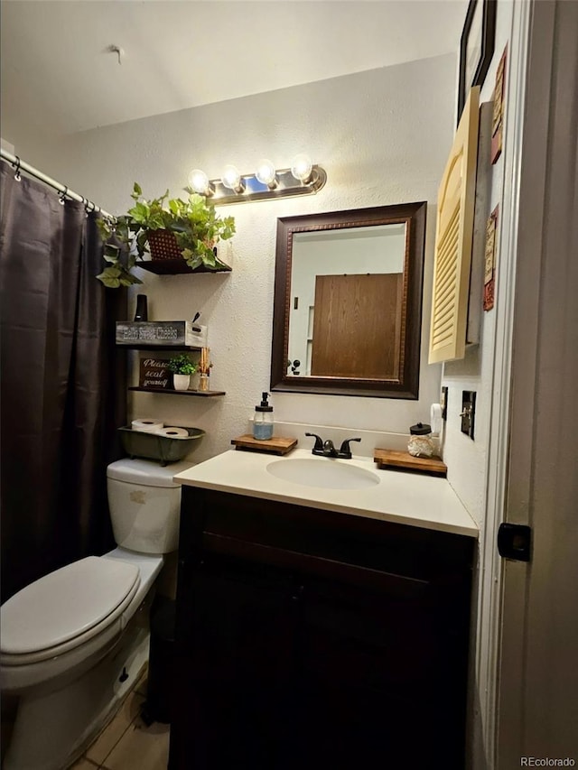 2034 S Truckee St, Aurora, CO 80013 - bathroom featuring vanity and a textured wall