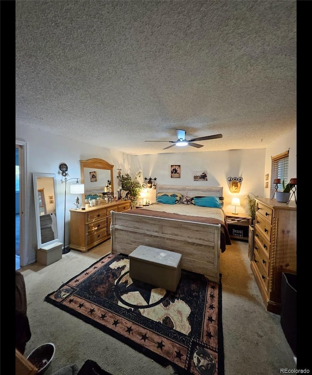 2034 S Truckee St, Aurora, CO 80013 - bedroom featuring light colored carpet, a textured ceiling, and a ceiling fan