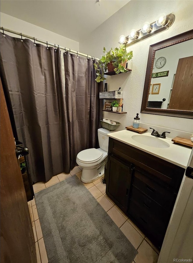 2034 S Truckee St, Aurora, CO 80013 - full bath with tile patterned flooring, vanity, a textured wall, and a shower with shower curtain