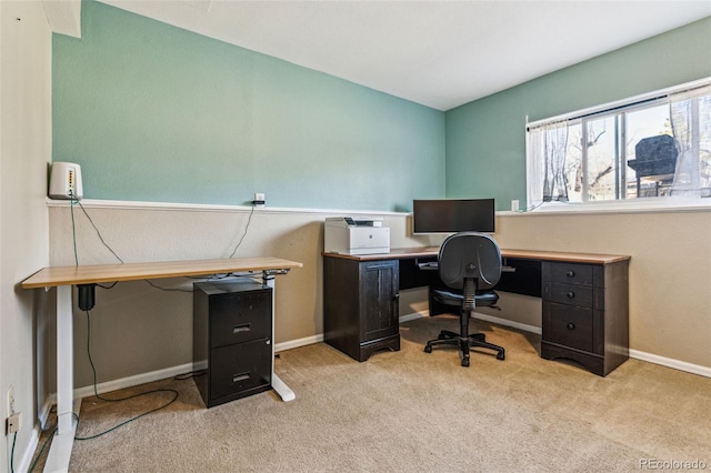 office space featuring light colored carpet and baseboards