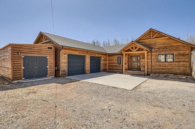 44 Forest Ridge Cir, Bailey, CO 80421 - chalet / cabin with a garage and concrete driveway
