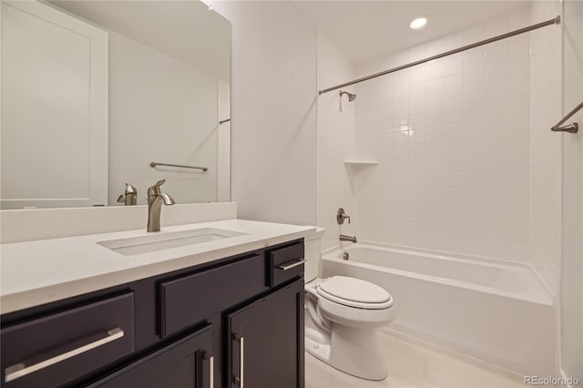 full bathroom featuring toilet, tiled shower / bath combo, vanity, and tile patterned floors