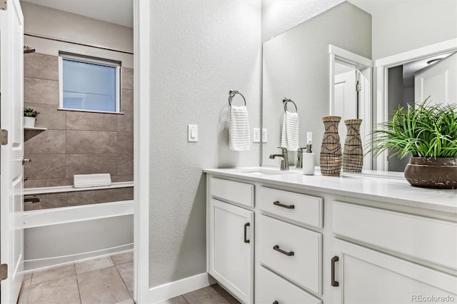 bathroom with vanity, tile patterned floors, and tiled shower / bath combo