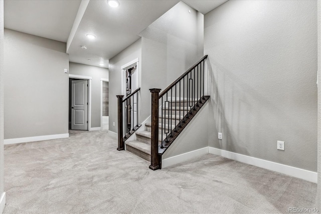 staircase with carpet