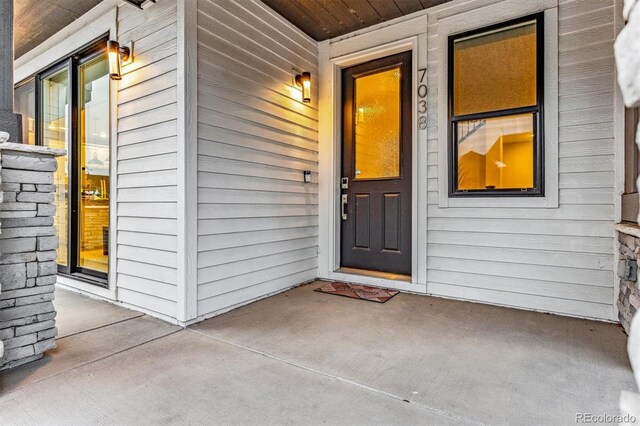 doorway to property with a porch