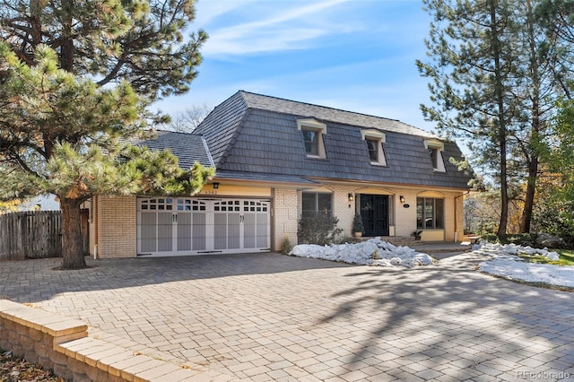 view of front of property with a garage