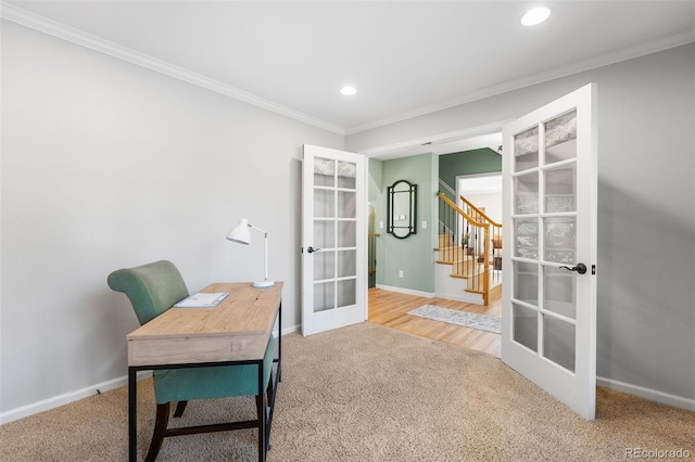 carpeted home office with french doors and crown molding