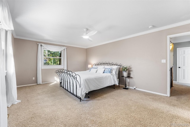 carpeted bedroom with crown molding and ceiling fan