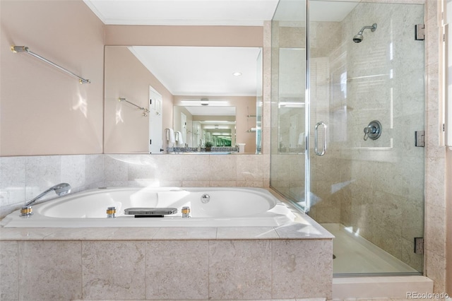 bathroom featuring crown molding and independent shower and bath