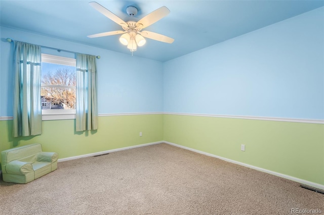 carpeted empty room with ceiling fan