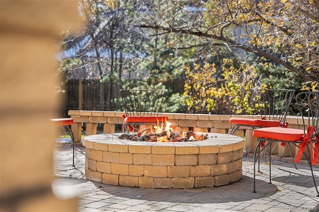 view of patio / terrace with a fire pit