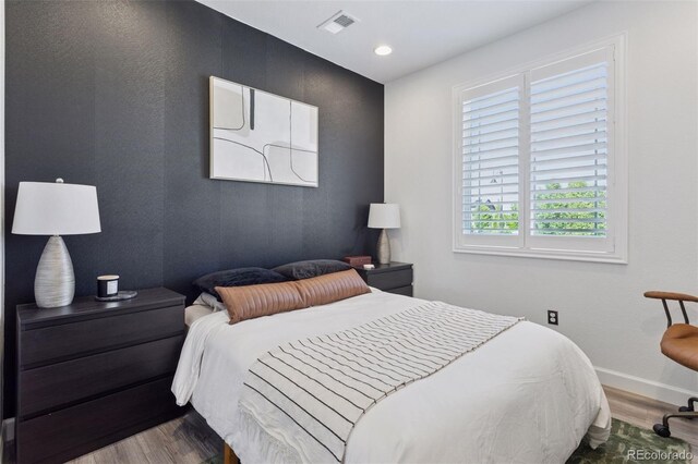 25106 E 1st Ave, Aurora, CO 80018 - bedroom featuring wood finished floors and recessed lighting