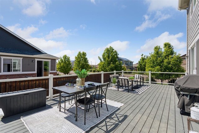 25106 E 1st Ave, Aurora, CO 80018 - deck featuring outdoor dining area and a grill