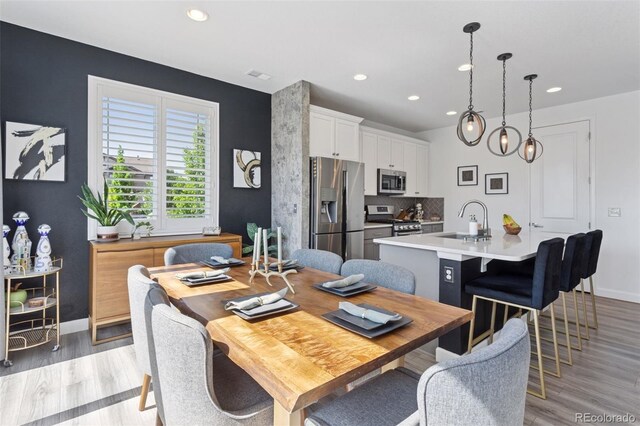 25106 E 1st Ave, Aurora, CO 80018 - dining space featuring recessed lighting and light wood finished floors