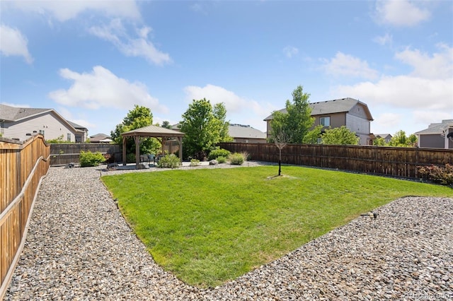25106 E 1st Ave, Aurora, CO 80018 - fenced backyard with a gazebo, a patio area, and a residential view