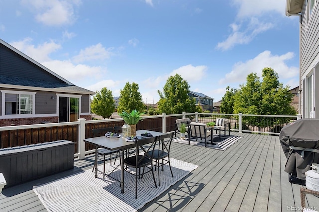 25106 E 1st Ave, Aurora, CO 80018 - deck featuring outdoor dining area and a grill