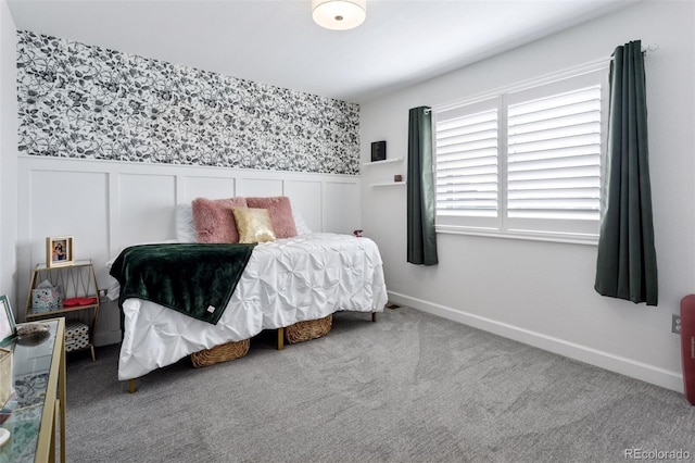25106 E 1st Ave, Aurora, CO 80018 - bedroom featuring a wainscoted wall, wallpapered walls, and carpet flooring