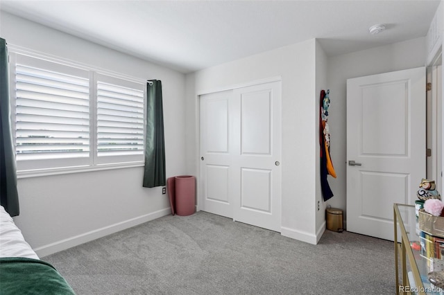 25106 E 1st Ave, Aurora, CO 80018 - carpeted bedroom with baseboards and a closet