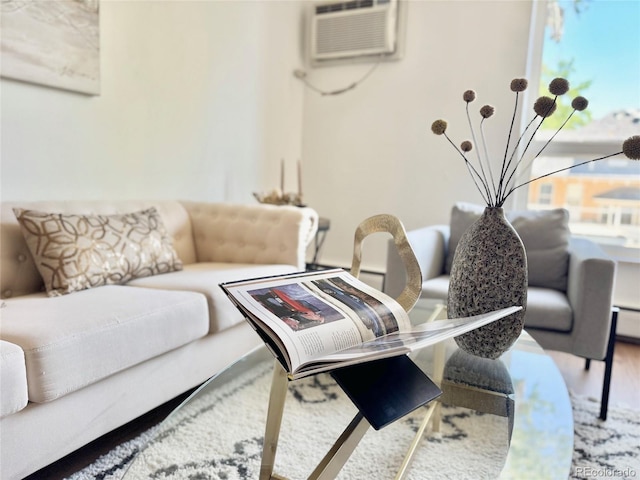 1050 N Lafayette St Unit 408, Denver, CO 80218 - living room with a wall unit AC and wood finished floors