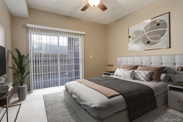 carpeted bedroom with access to exterior and ceiling fan