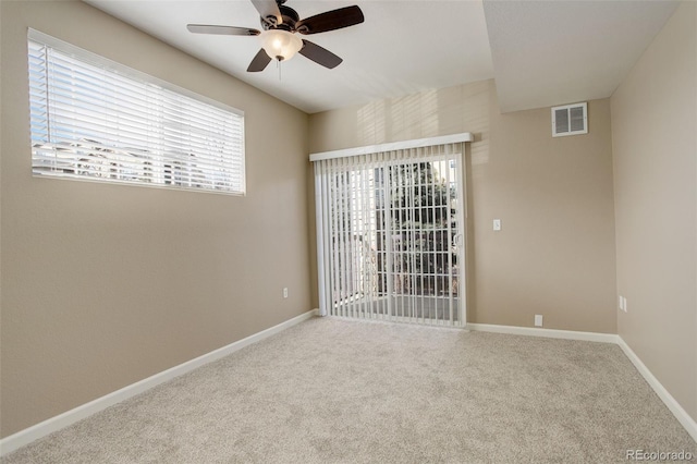 carpeted empty room with ceiling fan