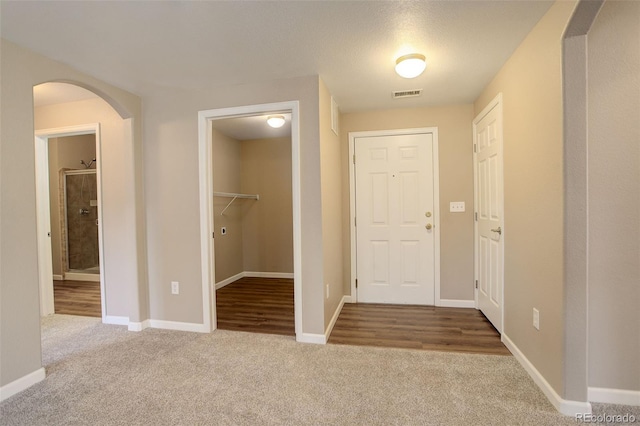 view of carpeted entrance foyer