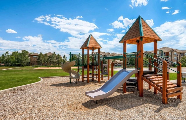 view of jungle gym with a lawn