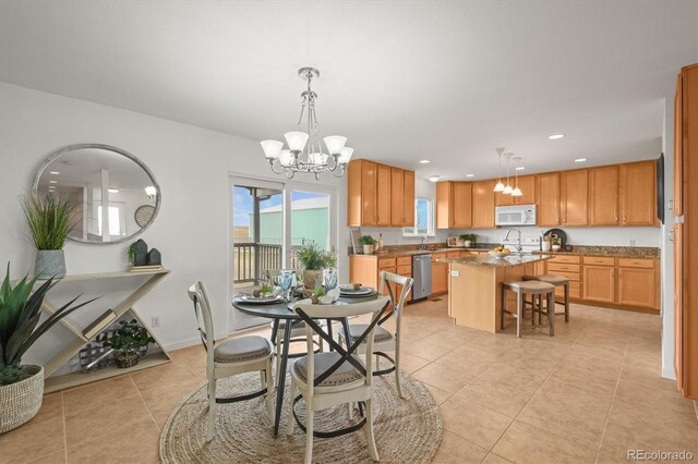 2845 Cherry Way, Parker, CO 80138 - dining area with a chandelier, light tile patterned floors, and recessed lighting