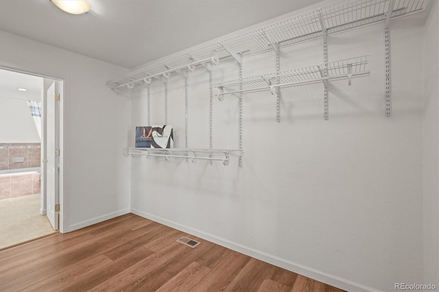 2845 Cherry Way, Parker, CO 80138 - walk in closet featuring wood finished floors