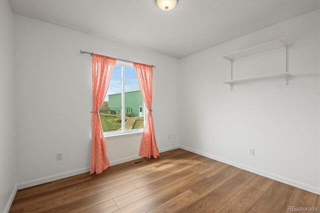 2845 Cherry Way, Parker, CO 80138 - spare room featuring wood finished floors and baseboards