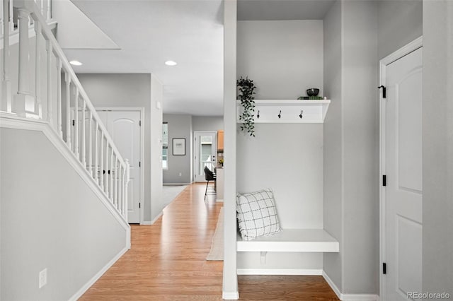 mudroom with light hardwood / wood-style flooring