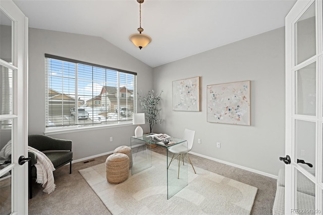 office space featuring french doors, lofted ceiling, and carpet flooring