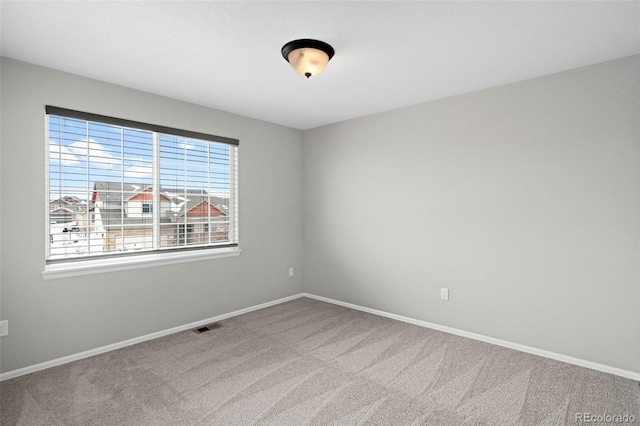 view of carpeted spare room