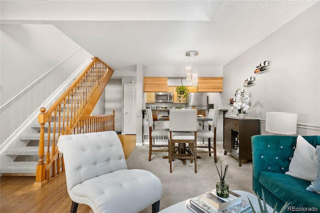 5155 W 68th Ave Unit 5, Westminster, CO 80030 - living room featuring stairs and a textured ceiling