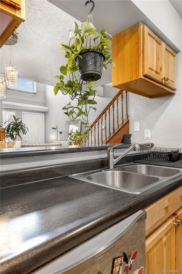 5155 W 68th Ave Unit 5, Westminster, CO 80030 - kitchen view of a sink, dark countertops, and pendant lighting