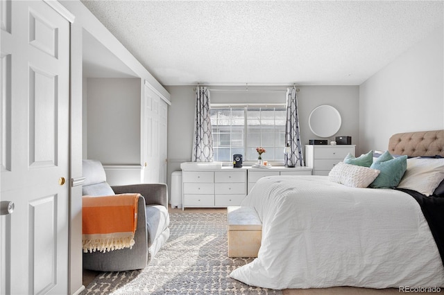 5155 W 68th Ave Unit 5, Westminster, CO 80030 - bedroom featuring a textured ceiling