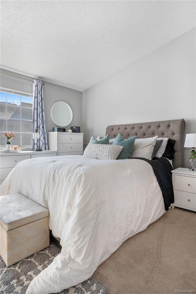 5155 W 68th Ave Unit 5, Westminster, CO 80030 - bedroom featuring a textured ceiling and carpet floors