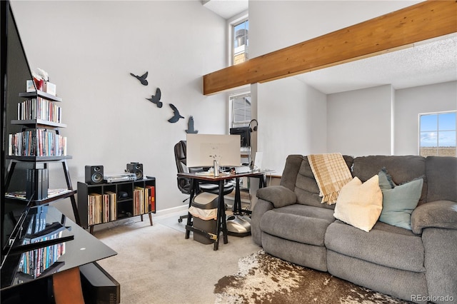 5155 W 68th Ave Unit 5, Westminster, CO 80030 - carpeted living area with a desk, baseboards, and a towering ceiling