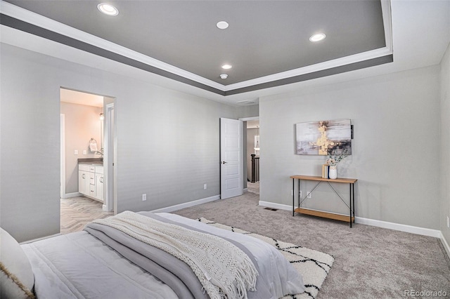 1011 White Leaf Cir, Castle Rock, CO 80108 - carpeted bedroom with baseboards, recessed lighting, a raised ceiling, ornamental molding, and ensuite bathroom