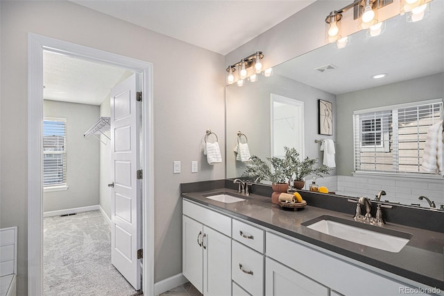 1011 White Leaf Cir, Castle Rock, CO 80108 - full bathroom with double vanity and baseboards