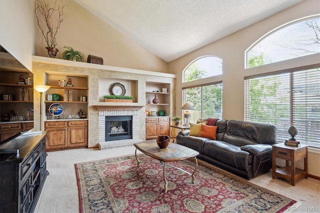 7354 S Robb St, Littleton, CO 80127 - living room with light carpet, a textured ceiling, a brick fireplace, high vaulted ceiling, and built in features