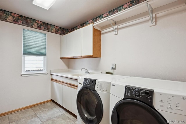 7354 S Robb St, Littleton, CO 80127 - clothes washing area with washing machine and dryer, cabinet space, baseboards, and light tile patterned floors