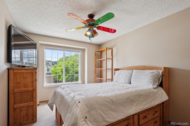 7354 S Robb St, Littleton, CO 80127 - carpeted bedroom with a textured ceiling, a ceiling fan, and baseboards