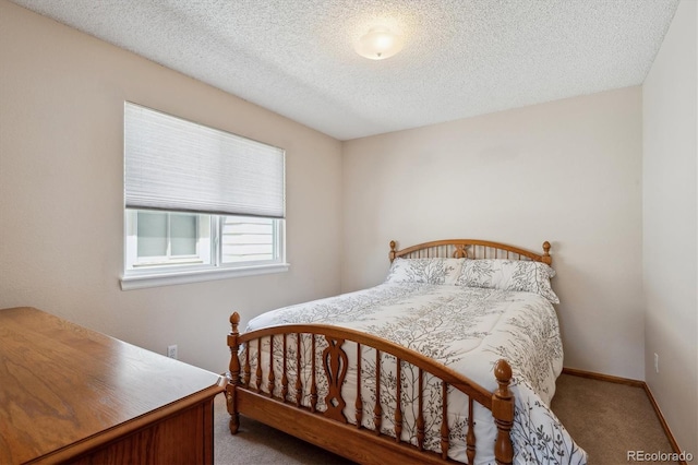 7354 S Robb St, Littleton, CO 80127 - carpeted bedroom with baseboards and a textured ceiling