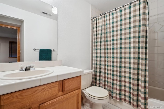7354 S Robb St, Littleton, CO 80127 - bathroom featuring toilet, shower / bath combo with shower curtain, and vanity